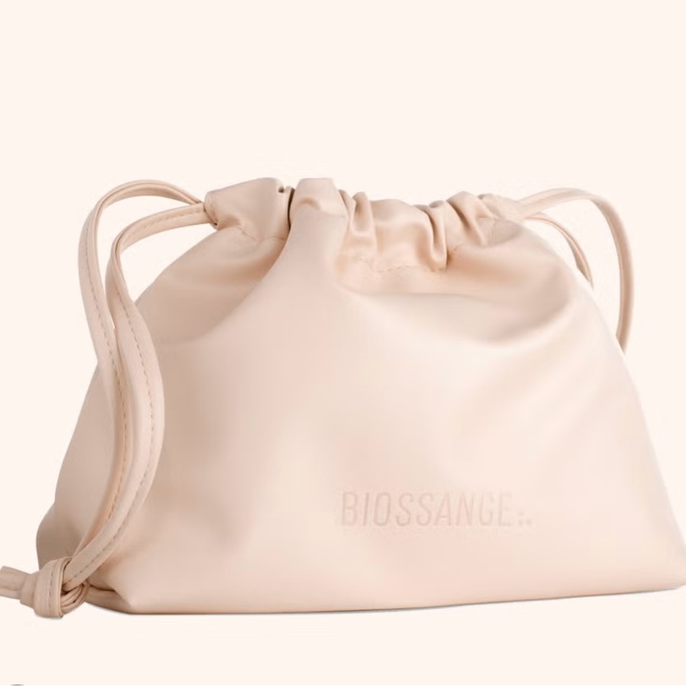 Biossance Drawstring Cosmetic Bag with Dry Brush, Straw Set, and Hat